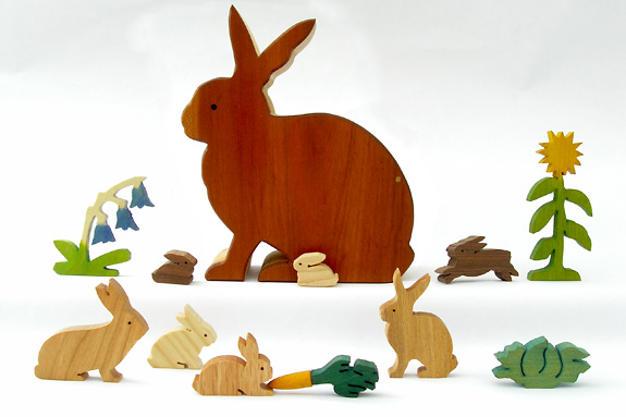 wooden rabbits and plants in a rabbit box